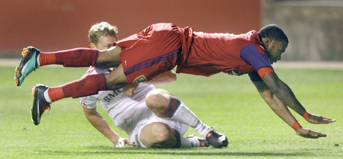 Steve Griffin  |  The Salt Lake Tribune&#xA; &#xA;Toronto FC's Ty Harden tackles Real Salt Lake's Robbie Findley during first half action of the Real Salt Lake versus Toronto FC soccer game at Rio Tinto Stadium in Sandy Wednesday, September 15, 2010.