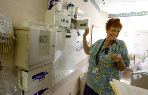 Leah Hogsten  |  The Salt Lake Tribune 
Nurse Doris Cowan shares a laugh with a patient while delivering post-operation information and medications.  St. Mark's Hospital invests its profits locally to improve services and purchase technology that ensures good outcomes and patient safety. For example, less than 25 percent of U.S. hospitals have bar-coding medication monitoring systems. All HCA hospitals have this patient safety technology, including St. Mark's. St. Mark's Hospital is among most profitable hospitals in country, which it attributes to its efficiency in Salt Lake City on Wednesday, September 15, 2010.
