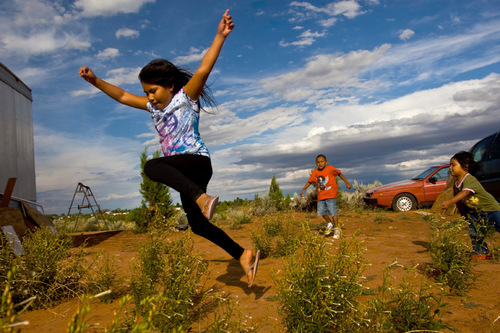 Chris Detrick  |  The Salt Lake Tribune &#xA;Danny Gonzalez, 6, center, Sophia Gonzalez, 3, right, and Faith Billsie, 9, play outside of their home in Westwater Thursday August 19, 2010. The roughly two-dozen Navajo residents of Westwater, many who are elderly, live without running water, plumbing, sewage disposal or electricity.