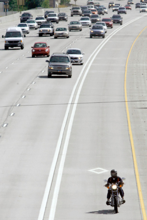 Steve Griffin  |  The Salt Lake Tribune&#xA; &#xA;A motorcyclist zips along I-15 in the HOV Lane near 2700 south in Salt Lake City Wednesday, September 15, 2010.
