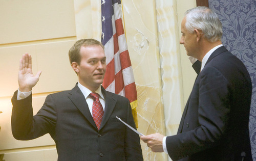 Al Hartmann  |  The Salt Lake Tribune  1/12/2009
Ben McAdams, left, takes his oath of office as a state senator from Senate President Michael Wadddoups in a brief ceremony in the Senate Chamber on Jan. 12, 2009.