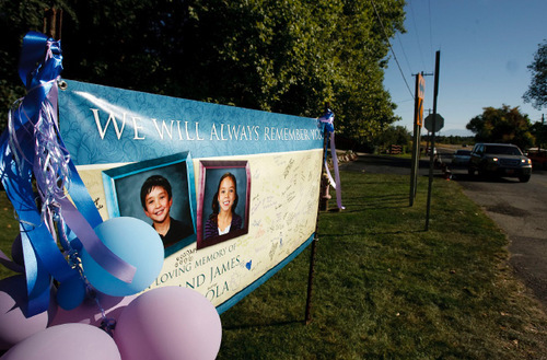 Leah Hogsten  |  The Salt Lake Tribune&#xA;The Layton east bench neighborhood  signed and hung a banner at the intersection of Cherry Lane and Valley View Drive in honor of James and Jean Warhola, siblings who were allegedly killed by their mother. They were buried  Friday in Salt Lake City. Sun Cha Warhola, 44, is charged with aggravated murder -- which carries the potential for the death penalty -- for allegedly killing her 8-year-old son, James, and 7-year-old daughter, Jean.