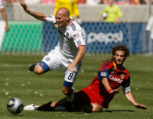 Leah Hogsten  |  The Salt Lake Tribune &#xA;Real's Kyle Beckerman sends Chicago's Freddie Ljungberg flying to the ground. &#xA;Real Salt Lake defeated the Chicago Fire 1-0  at Rio Tinto Stadium Saturday, September 18, 2010, in Sandy.