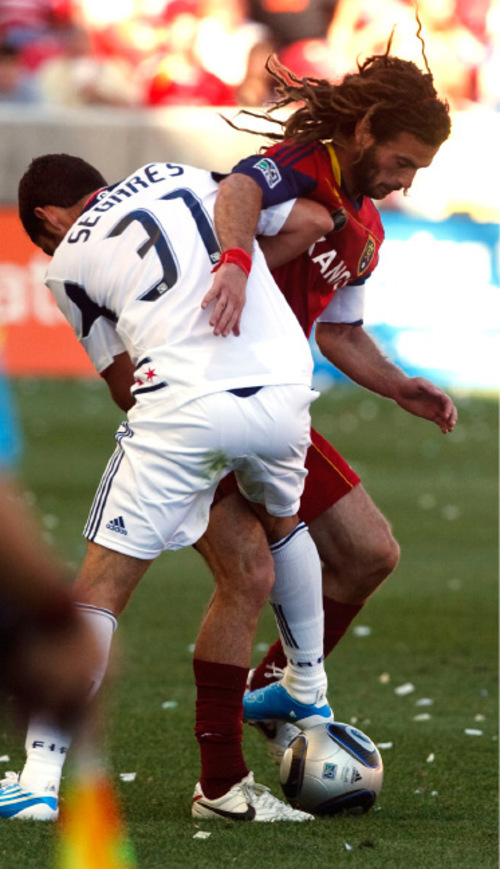 Leah Hogsten  |  The Salt Lake Tribune &#xA;Real's Kyle Beckerman battles Chicago's Gonzalo Segares. &#xA;Real Salt Lake defeated the Chicago Fire 1-0  at Rio Tinto Stadium Saturday, September 18, 2010, in Sandy.