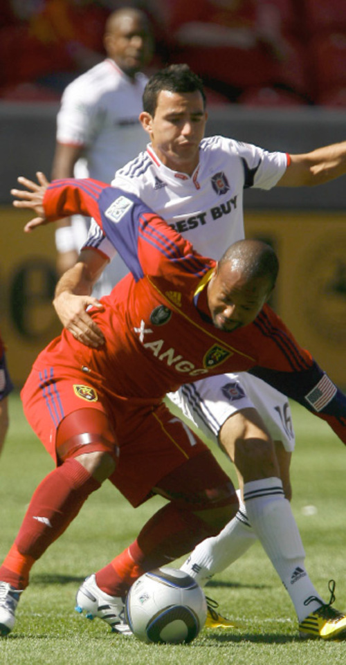 Leah Hogsten  |  The Salt Lake Tribune &#xA;Real's Andy Williams battles Chicago's Marco Pappa. &#xA;Real Salt Lake defeated the Chicago Fire 1-0  at Rio Tinto Stadium Saturday, September 18, 2010, in Sandy.