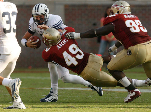 Trent Nelson  |  The Salt Lake Tribune&#xA;BYU quarterback Jake Heaps (9) is sacked by Florida State's Jeff Luc in the second half, BYU vs. Florida State, college football Saturday, September 18, 2010 at Doak Campbell Stadium in Tallahassee, Florida.