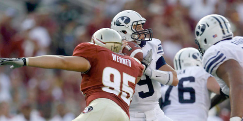Trent Nelson  |  The Salt Lake Tribune&#xA;Florida State's Bjoern Werner strips the ball from BYU quarterback Jake Heaps (9) during the second half, BYU vs. Florida State, college football Saturday, September 18, 2010 at Doak Campbell Stadium in Tallahassee, Florida.