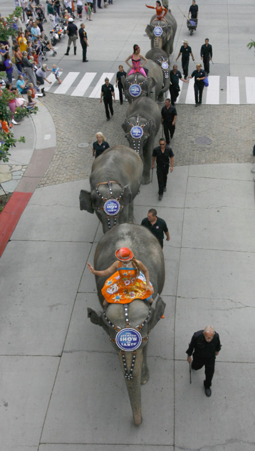 Rick Egan   |  The Salt Lake Tribune&#xA;&#xA;&#xA;Glinda Figueiredo,  Daniele Giamtaoli and Clarissa Olidera wave to the crowd as the  Elephant Parade winds down Rio Grande Street at The Gateway on Wednesday, Sept. 22, 2010.   It was Elephant Appreciation Day as the Ringling Bros. and Barnum & Bailey Circus rolled into town.