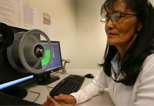 Scott Sommerdorf/ The Salt Lake Tribune

Pat Gordon loads microfilm onto a reel in order to scan it into the Footnote.com system. The Lindon company is being bought by Ancestry.com.