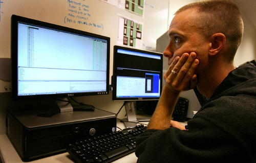 Salt Lake Tribune file photo / Scott Sommerdorf

Aaron Spencer sorts through the huge amount of historical documents that have been scanned at Footnnote.com in Lindon. Ancestry.com of Provo is buying the company.