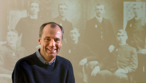 Tim Sullivan,the CEO of Ancestory.com in front of a photo featuring his  great grandfather, Thomas J. Sullivan (lower left) Wednesday, April 7,2010  photo:Paul Fraughton/ The Salt Lake Tribune
