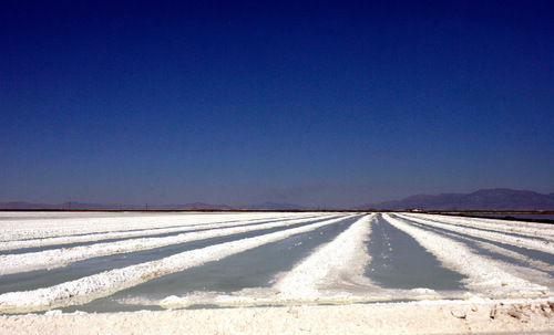 Rick Egan   |  The Salt Lake Tribune

Evaporation ponds at Great Salt Lake Minerals, on the shore of the Great Salt Lake, Thursday, September 23, 2010. GSL Minerals makes fertilizer by drawing water from the Great Salt Lake into solar evaporation ponds. Solar energy evaporates water from the ponds and yields the potassium and other minerals.