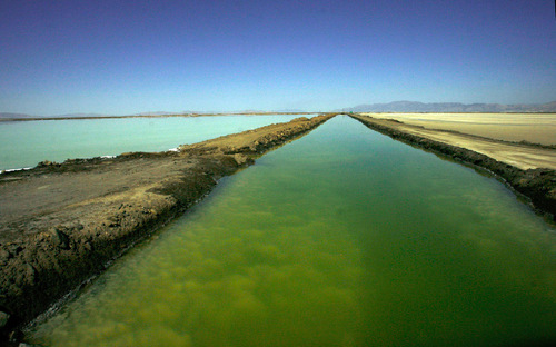 Rick Egan   |  The Salt Lake Tribune
Evaporation ponds at Great Salt Lake Minerals, on the shore of the Great Salt Lake, Thursday, September 23, 2010. GSL Minerals makes fertilizer by drawing water from the Great Salt Lake into solar evaporation ponds. Solar energy evaporates water from the ponds and yields the potassium and other minerals.