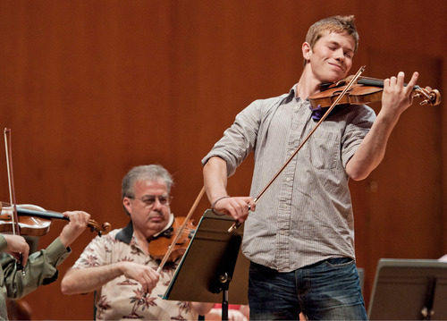 Michael Mangum  |  The Salt Lake Tribune
David Price rehearses with the Utah Symphony at Abravanel Hall in Salt Lake City on Monday, September 20, 2010. The Salute to Youth performance will feature nine local soloists and will be held on Tuesday, September 28, 2010.