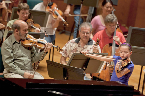 Michael Mangum  |  The Salt Lake Tribune
Shenae Anderson rehearses with the Utah Symphony at Abravanel Hall in Salt Lake City on Monday, September 20, 2010. The Salute to Youth performance will feature nine local soloists and will be held on Tuesday, September 28, 2010.