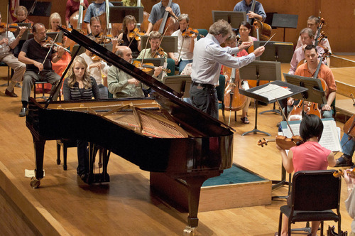 Michael Mangum  |  The Salt Lake Tribune
Natalie Coombs, playing the piano, rehearses with the Utah Symphony at Abravanel Hall in Salt Lake City on Monday, September 20, 2010. The Salute to Youth performance will feature nine local soloists and will be held on Tuesday, September 28, 2010.