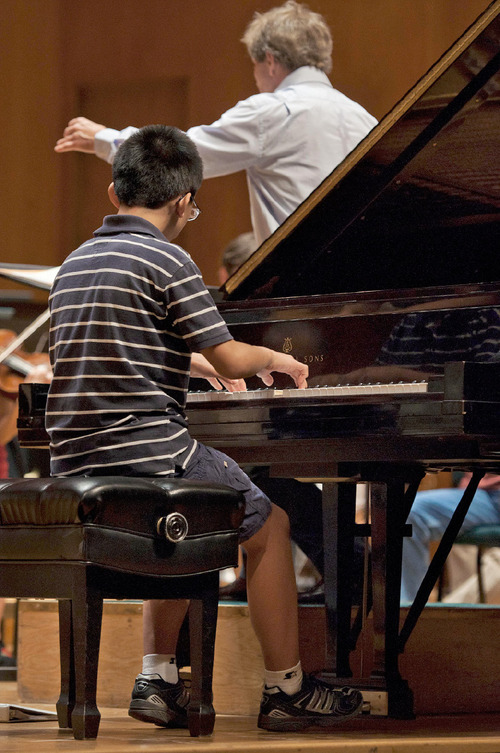 Michael Mangum  |  The Salt Lake Tribune
Anthony Cheng rehearses with the Utah Symphony at Abravanel Hall in Salt Lake City on Monday, September 20, 2010. The Salute to Youth performance will feature nine local soloists and will be held on Tuesday, September 28, 2010.