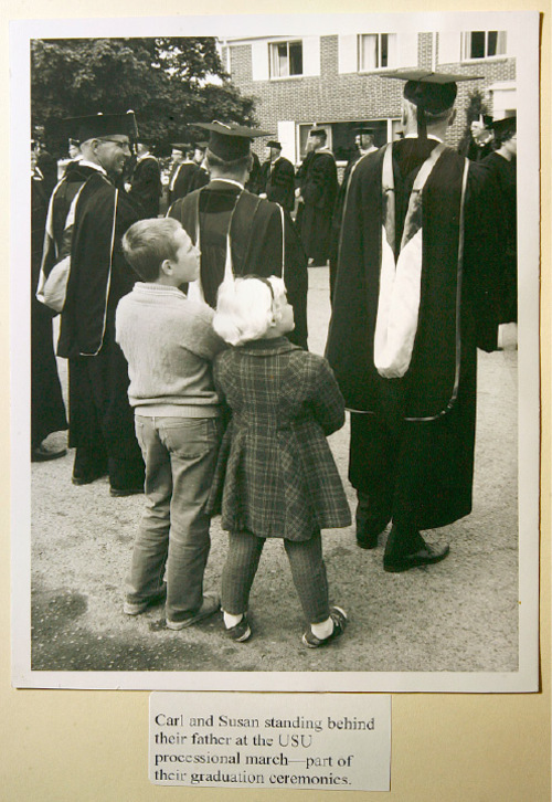 Scott Sommerdorf  l  The Salt Lake Tribune&#xA;A photo from the papers of Leonard J. Arrington showing his children, Carl (left) and Susan (right) stand behind their father at a USU processional.