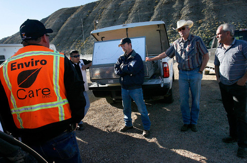 Scott Sommerdorf  l  The Salt Lake Tribune&#xA;Different jurisdictions come together at an early morning meeting to plan how to organize the cleanup efforts. From left: Scott Divan of Enviro Care, Leallen Blackhair of the Ute Tribe, Mike Lefler, Director of County Fire and Emergency Management, Duchesne County Commisioner Kent Petrus, and Commisioner Ron Winerton at far right.  An illegal dumping of oil into the Strawberry River near near the Duchesne County Fairgrounds was being contained and cleaned up early Saturday morning, September 24, 2010.