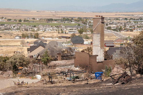 Michael Mangum  |  The Salt Lake Tribune&#xA;&#xA;Damage to the home of Val Johnson is seen in Herriman on Saturday, September 25, 2010. Johnson lost his home and many other belongings to the Machine Gun fire earlier in the week.