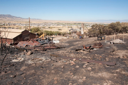 Michael Mangum  |  The Salt Lake Tribune&#xA;&#xA;Damage to the home and ten-acre property of Val Johnson is seen in Herriman on Saturday, September 25, 2010. Johnson lost his home and many other belongings to the Machine Gun fire earlier in the week.