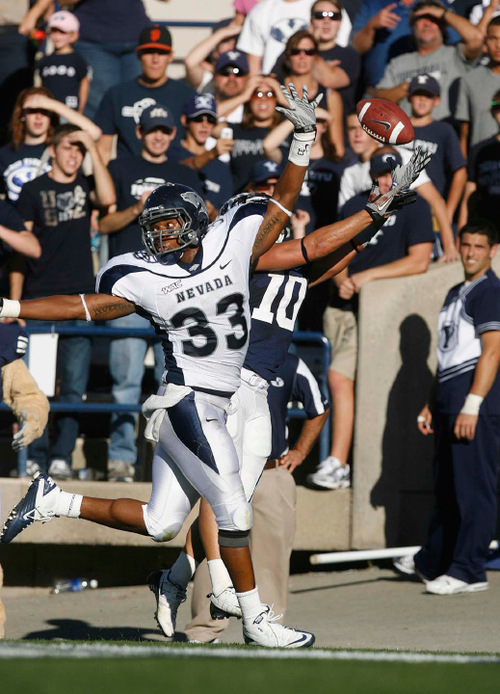 Trent Nelson  |  The Salt Lake Tribune&#xA;BYU running back JJ Di Luigi (10) reaches for the pass ahead of Nevada's Brandon Marshall. The pass was ruled incomplete. during the second quarter, BYU vs. Nevada, college football Saturday, September 25, 2010 at LaVell Edwards Stadium in Provo.