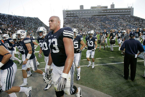 Trent Nelson  |  The Salt Lake Tribune&#xA;BYU players, including BYU offensive lineman Jason Speredon (73), head to the locker room after the loss, BYU vs. Nevada, college football Saturday, September 25, 2010 at LaVell Edwards Stadium in Provo.