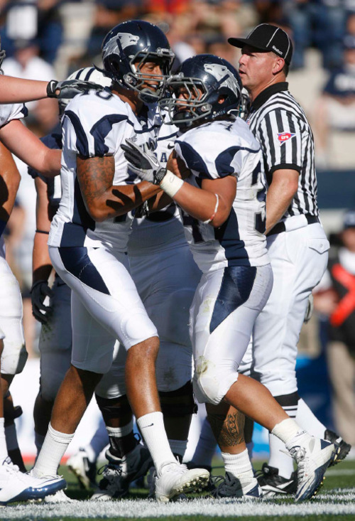 Trent Nelson  |  The Salt Lake Tribune&#xA;Nevada's Colin Kaepernick (10, left) and Vai Taua celebrate Taua's touchdown during the first quarter, BYU vs. Nevada, college football Saturday, September 25, 2010 at LaVell Edwards Stadium in Provo.