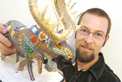 Leah Hogsten  |  The Salt Lake Tribune&#xA;Adam Rees holds a moose he sculpted, covered with clay and fired in a kiln. The West Valley artist makes animal sculptures from 