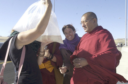 Kristen Moulton | The Salt Lake Tribune

Abigail Sullivan of Boulder, Utah, and Katog Getse Rinpoche, a
Tibetan Buddhist spiritual master , look at live brine shrimp in a
bag of water Monday morning before joining members of a Salt Lake City sangha (or spiritual community) in releasing brine shrimp egg back into the Great Salt Lake.