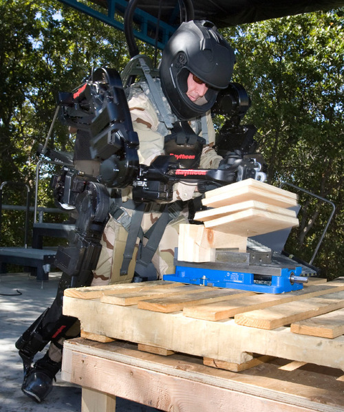 Steve Griffin  |  The Salt Lake Tribune&#xA; &#xA;Wearing the XOS-2 exoskeleton, Rex Jameson, test engineer for Raytheon-Sarcos, shatters boards with a punch during a demonstration at the company's offices in Research Park in Salt Lake City on Thursday, Sept. 23, 2010.