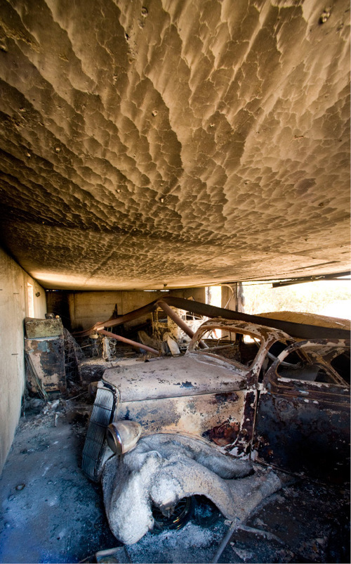 The remains of a 1936 Ford Coupe lies in the garage of the Johnson home Monday, Sept. 20, 2010, in Herriman, Utah. (© 2010 Douglas C. Pizac/Special to The Tribune)&#xA;