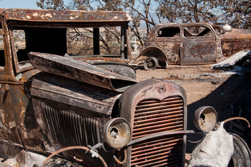 Michael Mangum  |  The Salt Lake Tribune&#xA;&#xA;Val Johnsons hot rods sit in the driveway on Saturday, September 25, 2010 after they were destroyed earlier in the week by the Machine Gun fire in Herriman. Johnson lost his home and many other belongings as well.