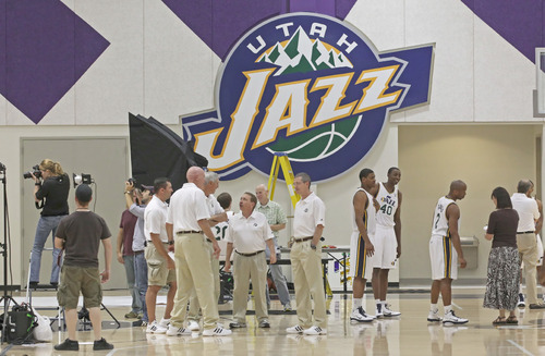 Utah Jazz players and coaches wait for interviews and to have their pictures taken during the NBA basketball team's media day in Salt Lake City on Monday, Sept. 27, 2010. (AP Photo/George Frey)