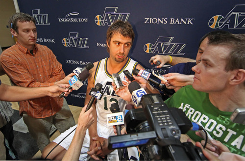 Utah Jazz's Mehmet Okur, from Turkey, talks with reporters during the NBA basketball team's media day in Salt Lake City on Monday, Sept. 27, 2010. Okur is expected to be out of the lineup for several months with an injury suffered in the playoffs last season. (AP Photo/George Frey)