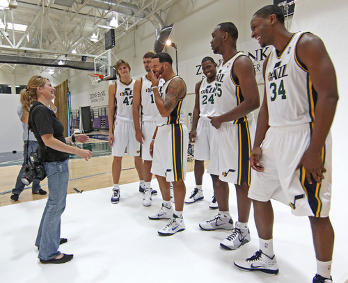 Utah Jazz players joke around with a photographer during the NBA basketball team's media day in Salt Lake City on Monday, Sept. 27, 2010. (AP Photo/George Frey)