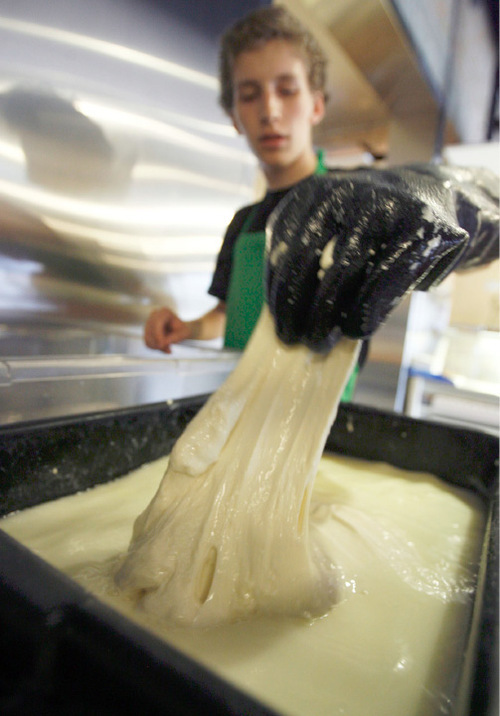 Francisco Kjolseth  |  The Salt Lake Tribune&#xA;Steve Floor begins to stretch cows milk cheese curd into mozarella at Caputo's Market in Salt Lake City. The 16-year-old makes several batches of fresh mozarella cheese each week. 