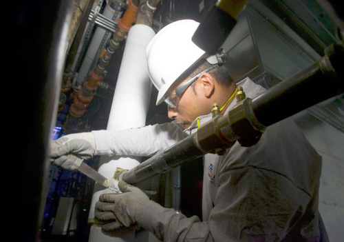 Al Hartmann  |  The Salt Lake Tribune&#xA;Already experienced in asbestos removal, Taylorsville resident Javier Mendez is learning how to install insulation around building cooling and heating systems as an employee of Thermal West, a North Salt Lake company that is one of the first to take advantage of a salary rebate, worth up to $2,000, that a Utah Department of Workforce Services program is providing to help people get off the roll of unemployment insurance recipients. The Utah Department of Workforce Services is using federal American Reinvestment and Recovery Act funds to provide financial incentives designed to encourage employers to provide jobs