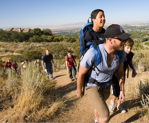 Al Hartmann  |  The Salt Lake Tribune&#xA;Gabe Adams, who does not have arms or legs, joined sixth-graders from Kaysville Elementary on Thursday to hike Adams Canyon above Layton. His older brother Brennan Adams carried Gabe in a backpack on the hike.