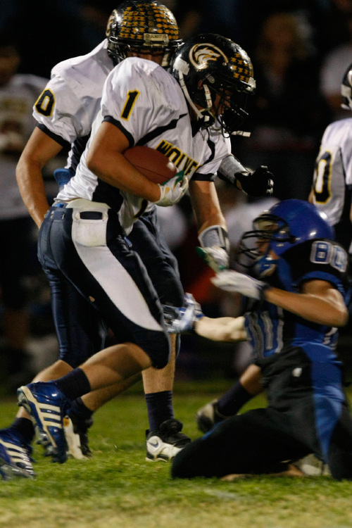 Chris Detrick  |  The Salt Lake Tribune &#xA;Enterprise's Jade Hulet #1 runs past Beaver's Jordan Hamm #80 during the second half of the game at Beaver High School Friday October 1, 2010.