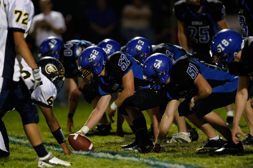 Chris Detrick  |  The Salt Lake Tribune &#xA;Beaver's Bo Fotheringham #52 prepares to snap the ball during the first half of the game at Beaver High School Friday October 1, 2010.