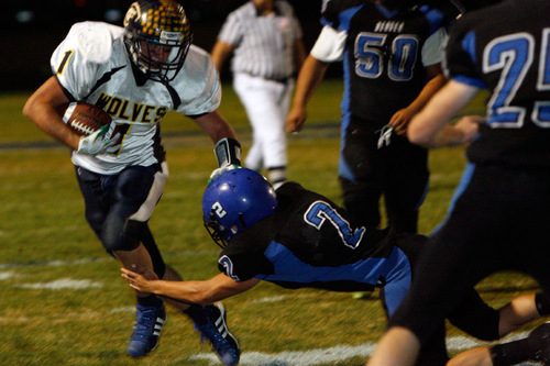 Chris Detrick  |  The Salt Lake Tribune &#xA;Enterprise's Jade Hulet #1 runs past Beaver's Keaton Green #2 during the second half of the game at Beaver High School Friday October 1, 2010.