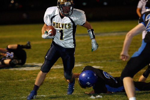 Chris Detrick  |  The Salt Lake Tribune &#xA;Enterprise's Jade Hulet #1 runs past Beaver's Keaton Green #2 during the second half of the game at Beaver High School Friday October 1, 2010.