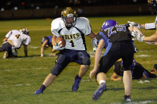 Chris Detrick  |  The Salt Lake Tribune &#xA;Enterprise's Jade Hulet #1 runs past Beaver's during the second half of the game at Beaver High School Friday October 1, 2010.