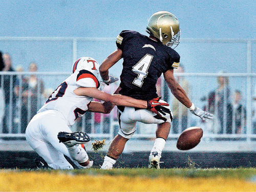 Scott Sommerdorf  l  The Salt Lake Tribune
Westlake DB Tre Ofahengaue (cq; 4) was called for pass interference while breaking up this pass to Timpview's WR Rickey Shumway (20) to set up a FG that gave Timpview an early 10-0 lead. Timpview held a 23-13 lead at the half at Westlake, Friday 10/1/2010.