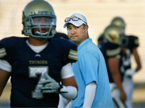 Scott Sommerdorf  l  The Salt Lake Tribune&#xA;Westlake head coach Jason Walker watches his team practice during pregame warmups before the game against Timpview. Timpview held a 23-13 lead at the half at Westlake, Friday 10/1/2010.