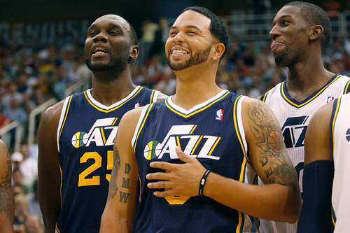Scott Sommerdorf  l  The Salt Lake Tribune
Al Jefferson (25), Deron Williams (8), and Jeremy Evans (right) laugh during introductions prior to a public scrimmage at Energy Solutions Arena on Oct. 2. Williams will be the undisputed leader of the team.