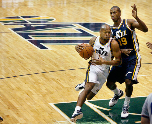 Scott Sommerdorf  l  The Salt Lake Tribune
Sundiata Gaines (2) drives against Raja Bell (19) with the new Jazz logo at center court during a public scrimmage at Energy Solutions Arena, Saturday 10/2/2010. The team is also unveiling a new court and introducing players.