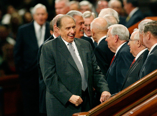 Scott Sommerdorf  l  The Salt Lake Tribune

President Thomas S. Monson jokes with members of the Quorum of the Seventy as he leaves LDS General Conference on Sunday.