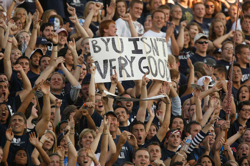 Trent Nelson  |  The Salt Lake Tribune&#xA;Utah State fans holding a sign reading, 